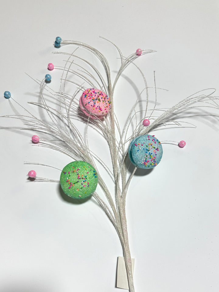 Pink, blue, and green macaroons spray with sprinkles